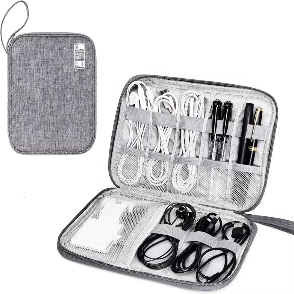 Gray travel organizer with compartments for electronic accessories on a white background