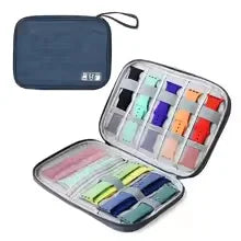 Open case with colorful thread spools on a white background
